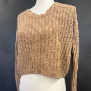 Brown/tan colored sweater. Looks reversible but I found that it is not.
